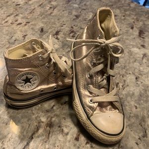 Super cool metallic rose gold high top Chuck Taylors